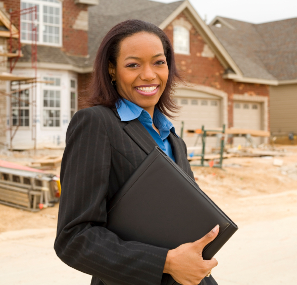 Realtor in front of new construction